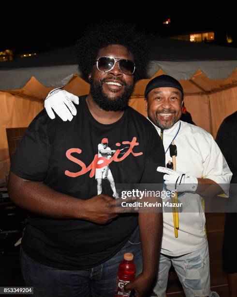 Drummers Questlove of The Roots and Carter Beauford of Dave Matthews Band pose backstage at "A Concert for Charlottesville," at University of...