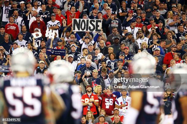 Fan holds a sign that says noise in the third quarter against the Kansas City Chiefs at Gillette Stadium on September 7, 2017 in Foxboro,...