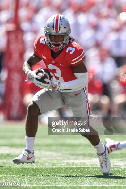 Damon Arnette of the Ohio State Buckeyes runs with the ball against the UNLV Rebels at Ohio Stadium on September 23, 2017 in Columbus, Ohio.