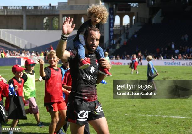 Frederic Michalak of LOU and his kid following the Top 14 match between Lyon OU and Castres Olympique at Matmut Stadium on September 24, 2017 in...