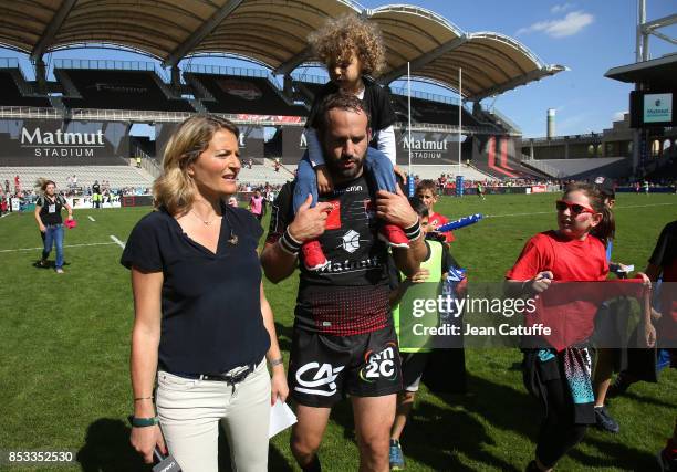 Frederic Michalak of LOU is interviewed by Astrid Bard of Canal Plus following the Top 14 match between Lyon OU and Castres Olympique at Matmut...