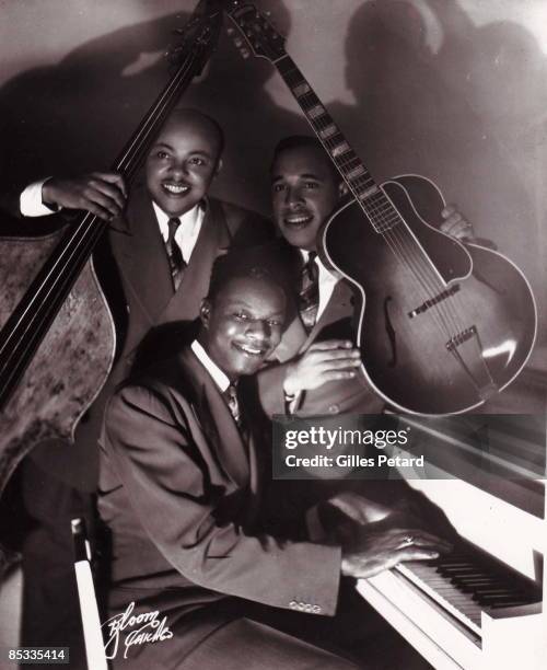 Photo of Nat King COLE and Oscar MOORE and Wesley PRINCE; Posed group portrait of the Nat King Cole Trio L-R Wesley Prince, Nat King Cole and Oscar...