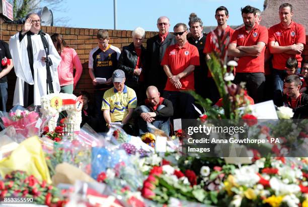 Members of the public and football fans gather together during the Hillsborough 25th Anniversary Memorial Service at Hillsborough, Sheffield.