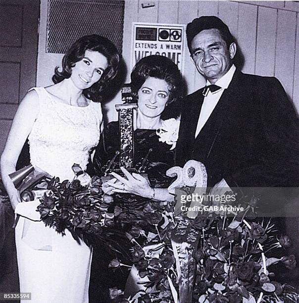 Photo of Johnny CASH and June CARTER and Mother Maybelle CARTER; L-R June Carter Cash, Maybelle Carter and Johnny Cash