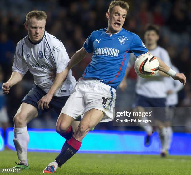 Rangers' Dean Shiels and Forfar Athletic's Mark Baxter during the Scottish League One match at Ibrox Stadium, Glasgow.