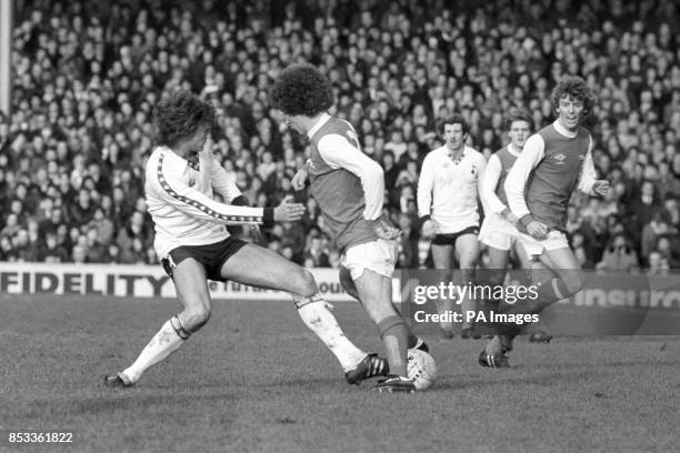 Glenn Hoddle , of Tottenham Hotspur, takes on Arsenal's Alan Sunderland during the Boxing Day Division One London derby at Highbury. An Alan...