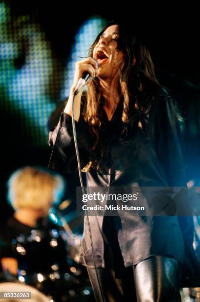 Photo of Alanis MORISSETTE; Alanis Morissette performing on stage