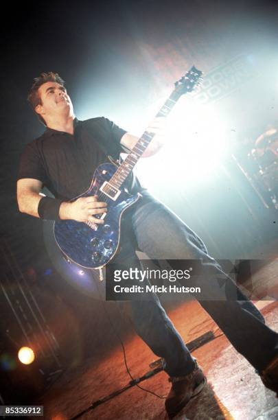 Photo of Chris HENDERSON and 3 DOORS DOWN; Chris Henderson performing on stage
