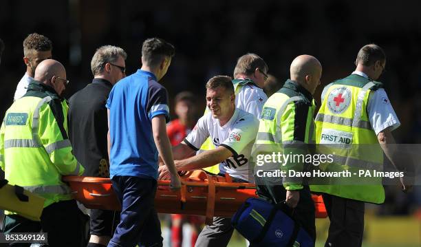 Port Vale's Tom Pope is stretchered off with a leg injury during the Sky Bet League One match at Vale Park, Stoke On Trent.