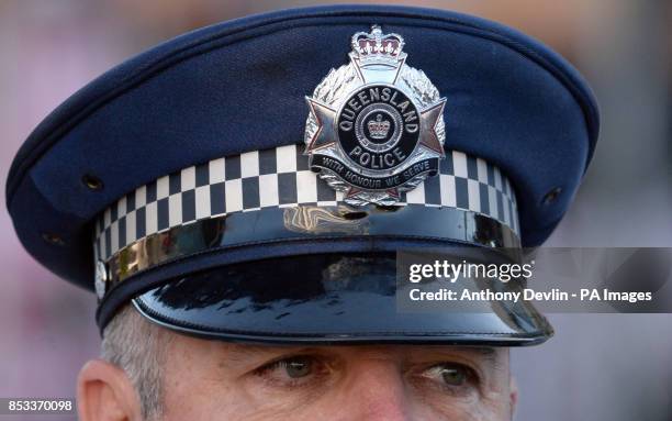 Police officer looks-on as the Duchess of Cambridge is surrounded by security guards following an earlier security threat as the Duke and Duchess of...