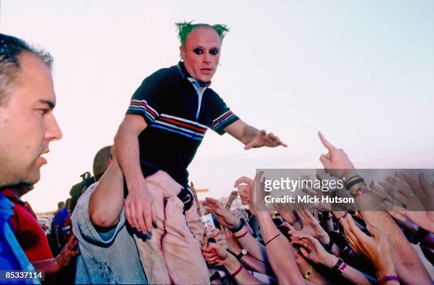 Photo of Keith FLINT and PRODIGY, Keith Flint performing on stage, audience hands
