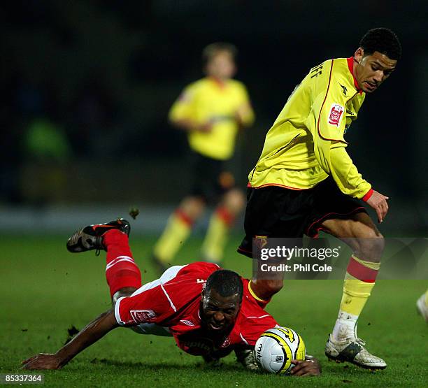 Jobi McAnuff of Watford battles for the ball with Wes Morgan of Nottingham Forest during the Coca Cola Championship match between Watford and...