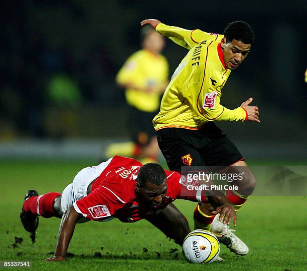 Jobi McAnuff of Watford battles for the ball with Wes Morgan of Nottingham Forest during the Coca Cola Championship match between Watford and...