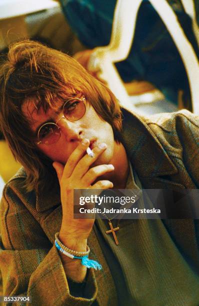 Photo of OASIS and Liam GALLAGHER, Portrait of Liam Gallagher, sunglasses, smoking cigarette