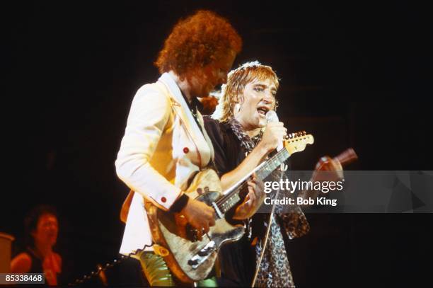 Photo of Rod STEWART and Jim CREGAN; Jim Cregan and Rod Stewart performing on stage