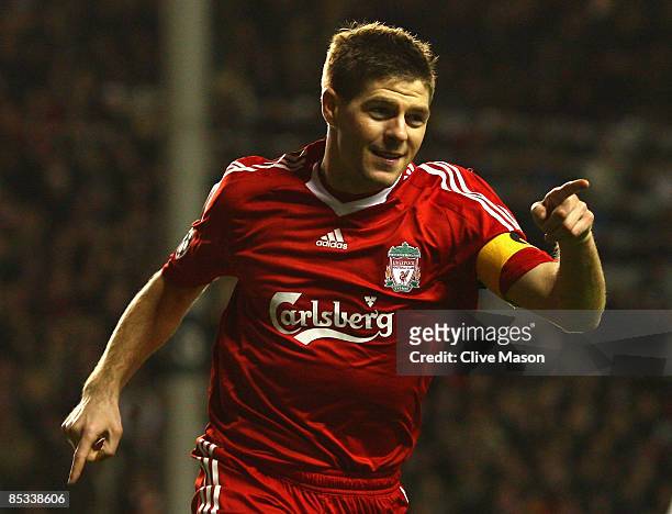 Steven Gerrard of Liverpool celebrates scoring his team's third goal during the UEFA Champions League Round of Sixteen, Second Leg match between...