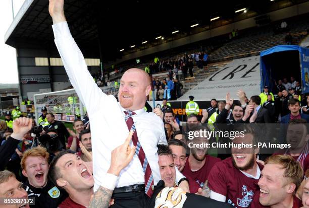 Burnley's manager Sean Dyche celebrates after his side win promotion to the Premier League during the Sky Bet Championship match at Turf Moor,...