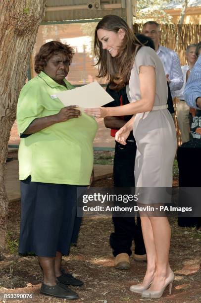 The Duchess of Cambridge presents certificates as the Duke and Duchess of Cambridge visit the National Indigenous Training Academy in Uluru during...