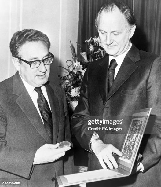 Dr Henry Kissinger receiving his Nobel Peace Prize from Mr Thomas Byrne, US Ambassador to Norway, at Claridge's Hotel, London. Mr Byrne accepted the...