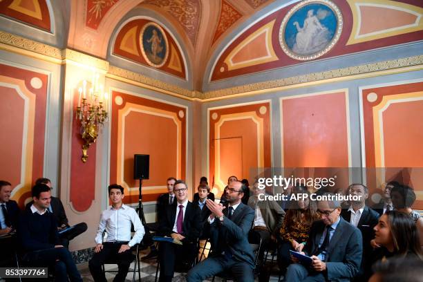 French Prime Minister Edouard Philippe , flanked by Prime Minister's Adviser for Social, Employment and Formation , speaks during a report on the...