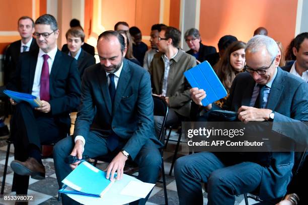 French Prime Minister Edouard Philippe , flanked by Prime Minister's Adviser for Social, Employment and Formation , attends a report on the Grand...