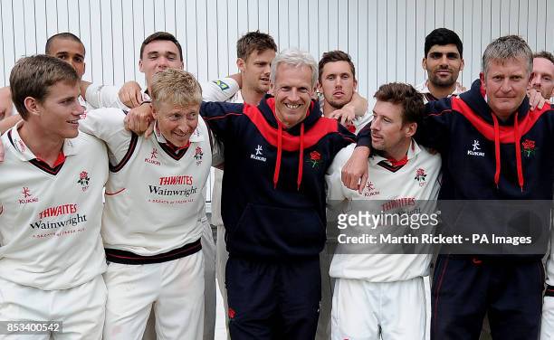 Peter Moores poses with his team on his last day as Lancashire head coach before he takes over as England head coach, after the LV County...