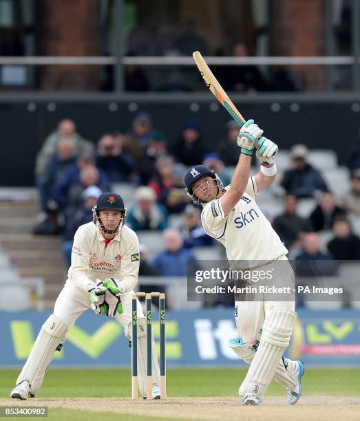 Warwickshire's Ian Bell hits for 4 from the bowling of Lancashire's Simon Kerrigan, during the LV County Championship, Division One match at the...