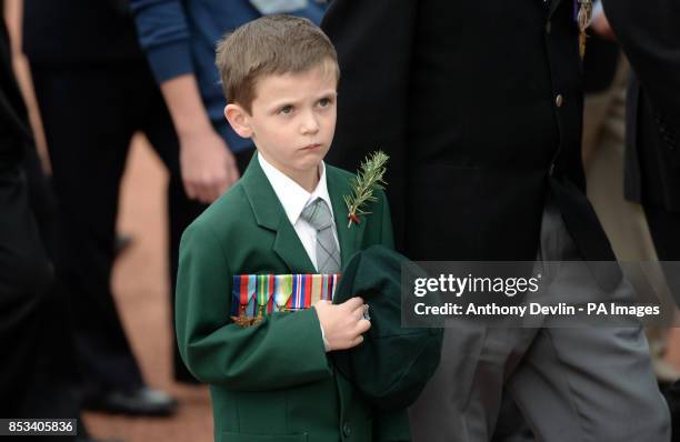 Young boy wearing medals participates in a parade as the Duke and Duchess of Cambridge attend the ANZAC March and Commemorative Service and lay a...