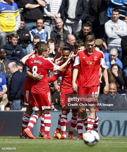 Southampton's Nathaniel Clyne celebrates with team-mates after his cross was put into the net by Everton's Seamus Coleman for the second goal