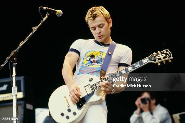 Photo of MANIC STREET PREACHERS and James Dean BRADFIELD; James Dean Bradfield performing on stage