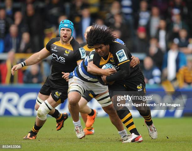 Wasps' Ashley Johnson is tackled by Bath's Leroy Houston during the Amlin Challenge Cup Semi Final match at Adams Park, High Wycombe.