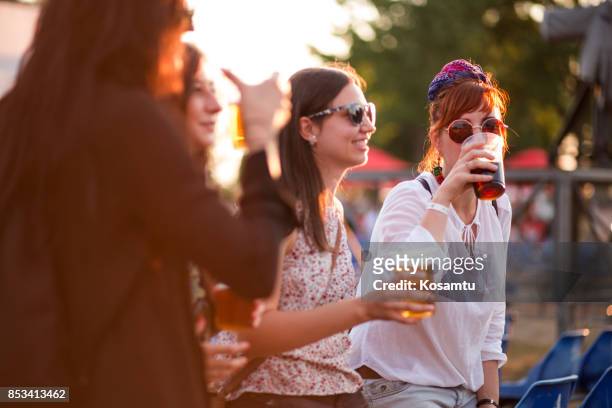 tasting beer in beer festival - alcohol abuse stock pictures, royalty-free photos & images