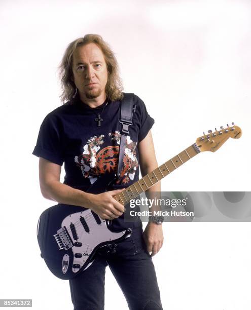 Photo of Adrian SMITH and IRON MAIDEN; Adrian Smith posed, studio, with Fender Stratocaster guitar