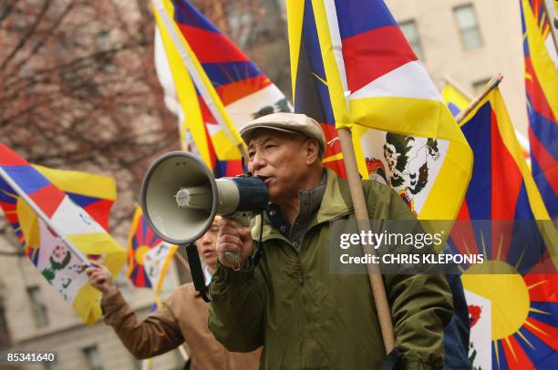 Demonstrators mark the 50th anniversary of the failed revolt against Chinese rule in Tibet by rallying at the Chinese Embassy in Washington on March...