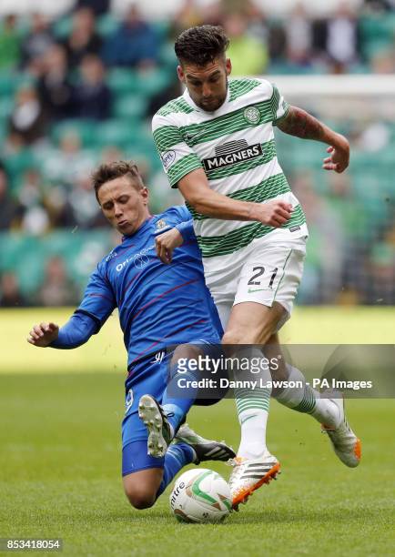 Celtic's Charlie Mulgrew and Inverness' Richie Foran battle for the ball during the Scottish Premier League match at Celtic Park, Glasgow.