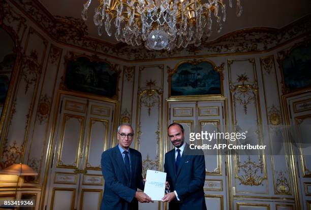 French Prime Minister Edouard Philippe poses with French economist Jean Pisani-Ferry following a report by Pisani-Ferry on the Grand Investment Plan...