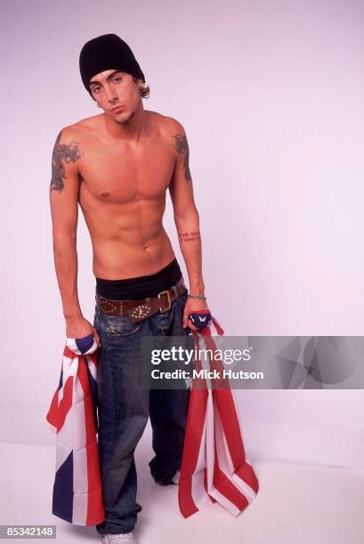 Photo of Ian WATKINS and LOSTPROPHETS; Ian Watkins - posed, studio, topless, holding US and UK flags