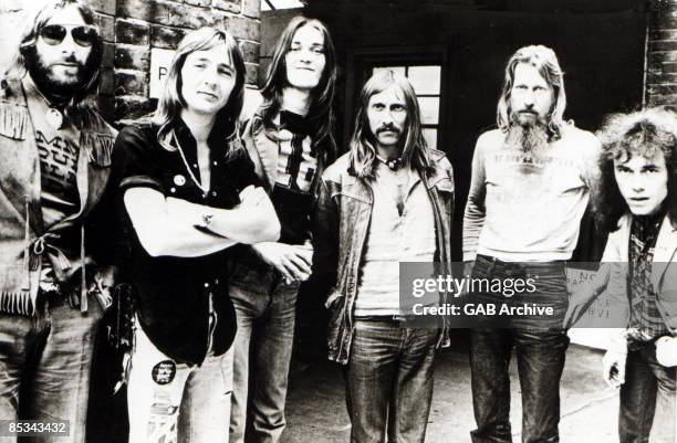 Photo of HAWKWIND and Alan POWELL and Simon KING and Dave BROCK and Nik TURNER; L-R: ?, Alan Powell, Simon King, Dave Brock, Nik Turner, ? - posed,...