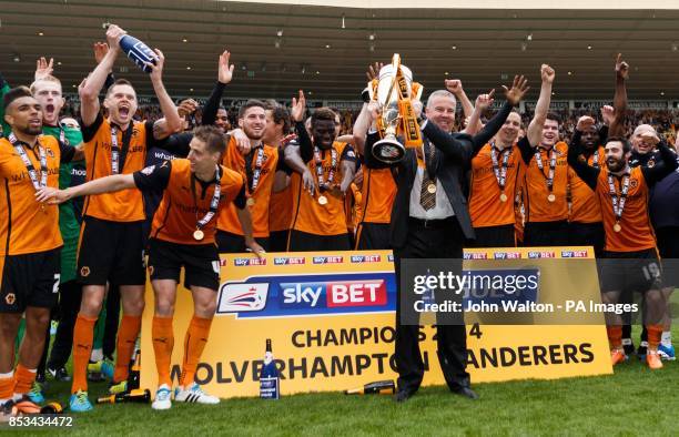 Wolverhampton Wanderers' manager Kenny Jackett celebrates with the trophy after the Sky Bet League One match at Molineux, Wolverhampton.