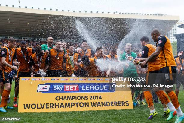 Wolverhampton Wanderers' players celebrate their promotion as champions during the Sky Bet League One match at Molineux, Wolverhampton.