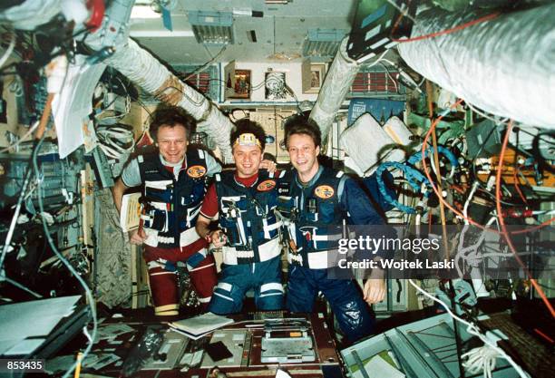 In this undated file photo, Mir Crew commander Yuri Gidzenko, middle, of the Russian Air Force, Flight Engineer Serguei Avdeyev, left, and German...