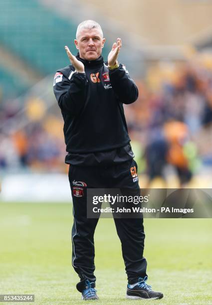 Carlisle United's manager Graham Kavanagh applauds the fans as his side are relegated during the Sky Bet League One match at Molineux, Wolverhampton.