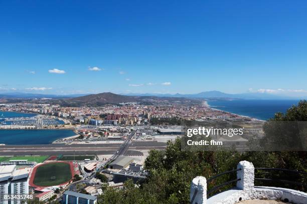 gibraltar airport - view from the nature reserve "upper rock" to the airport of gibraltar, la linea de la conception (spain) and the bay of algeciras and algeciras (also spain) - straits of gibraltar stock pictures, royalty-free photos & images