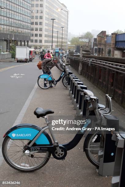 Commuters look for Barclays Cycle Hire bikes outside Waterloo station, London, on the second day of a 48 hour strike by tube workers on the London...