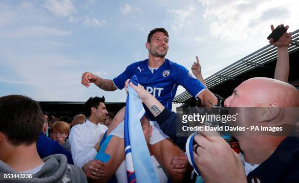 Chesterfield's Marc Richards celebrates winning the Sky Bet League Two at the Proact Stadium, Chesterfield.