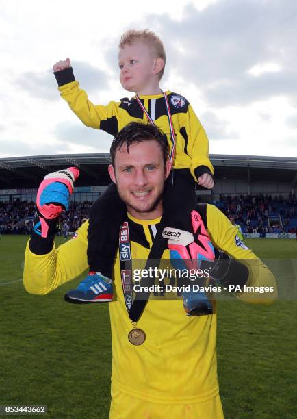 Chesterfield's Tommy Lee celebrates winning the Sky Bet League Two at the Proact Stadium, Chesterfield.