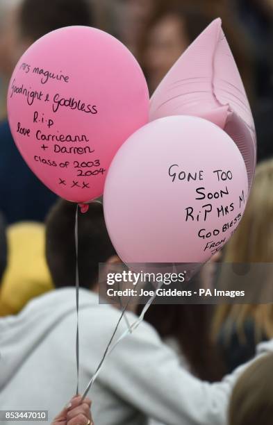 Tributes are written on balloons before being released into the sky in memory of teacher Ann Maguire who was stabbed to death by a pupil last week at...