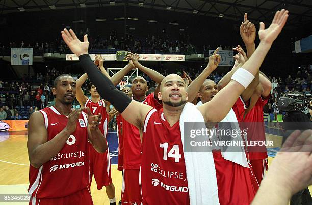 EclipseJet's players celebrate after defeating Mons during their Eurochallenge basketball match on March 10 in Mons. Amsterdam won 86-93. AFP PHOTO/...