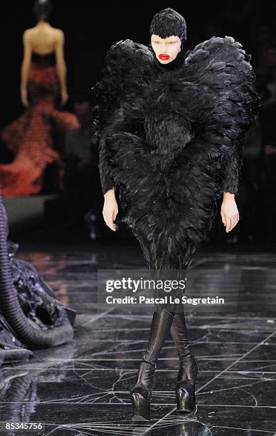 Model walks down the catwalk during the Alexander McQueen Ready-to-Wear A/W 2009 fashion show during Paris Fashion Week at POPB on March 10, 2009 in...