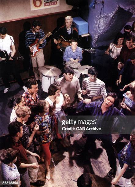 Photo of SHADOWS and Cliff RICHARD; with The Shadows in scene from the film 'Expresso Bongo'